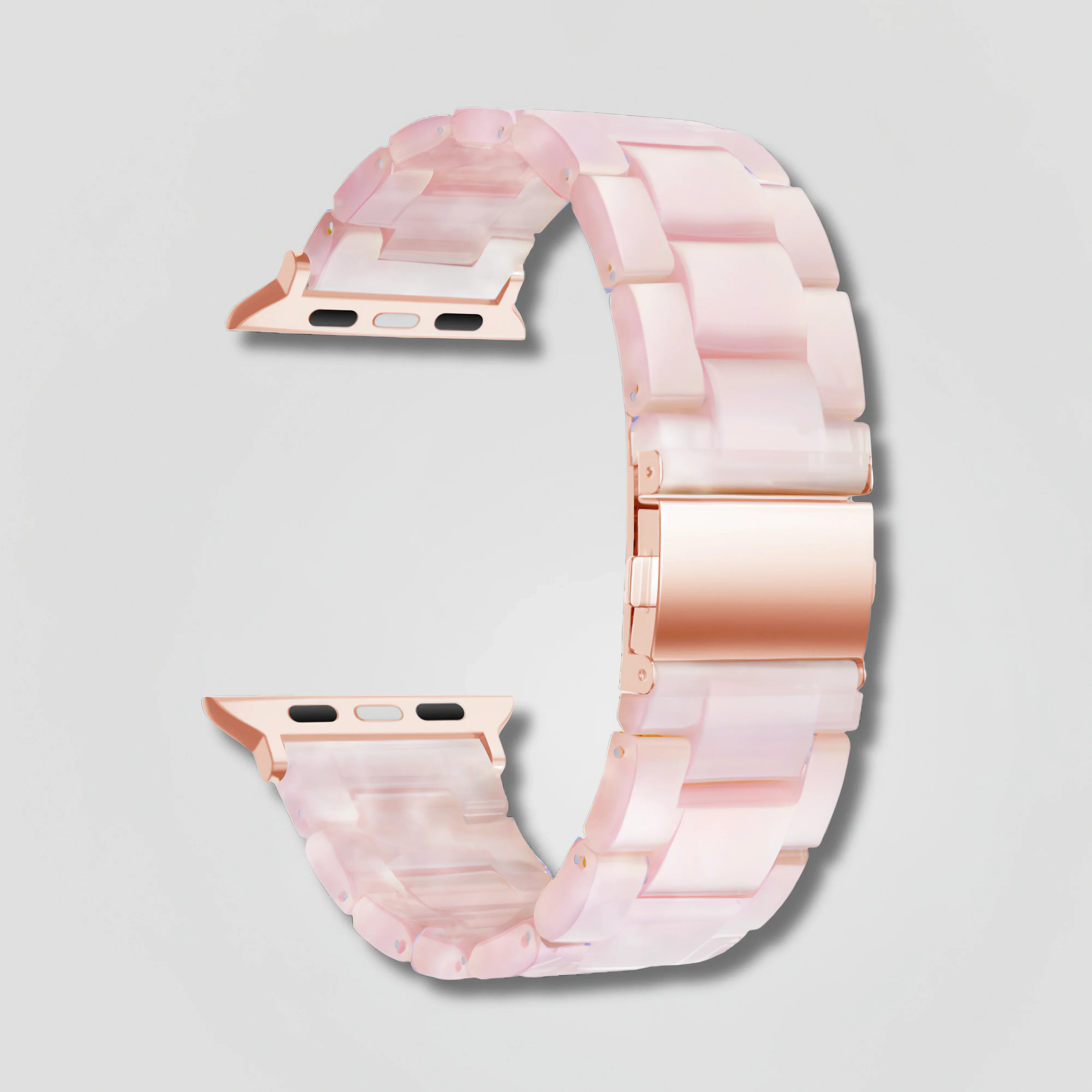 Pink pearl resin Apple Watch band with rose gold clasp on light gray background