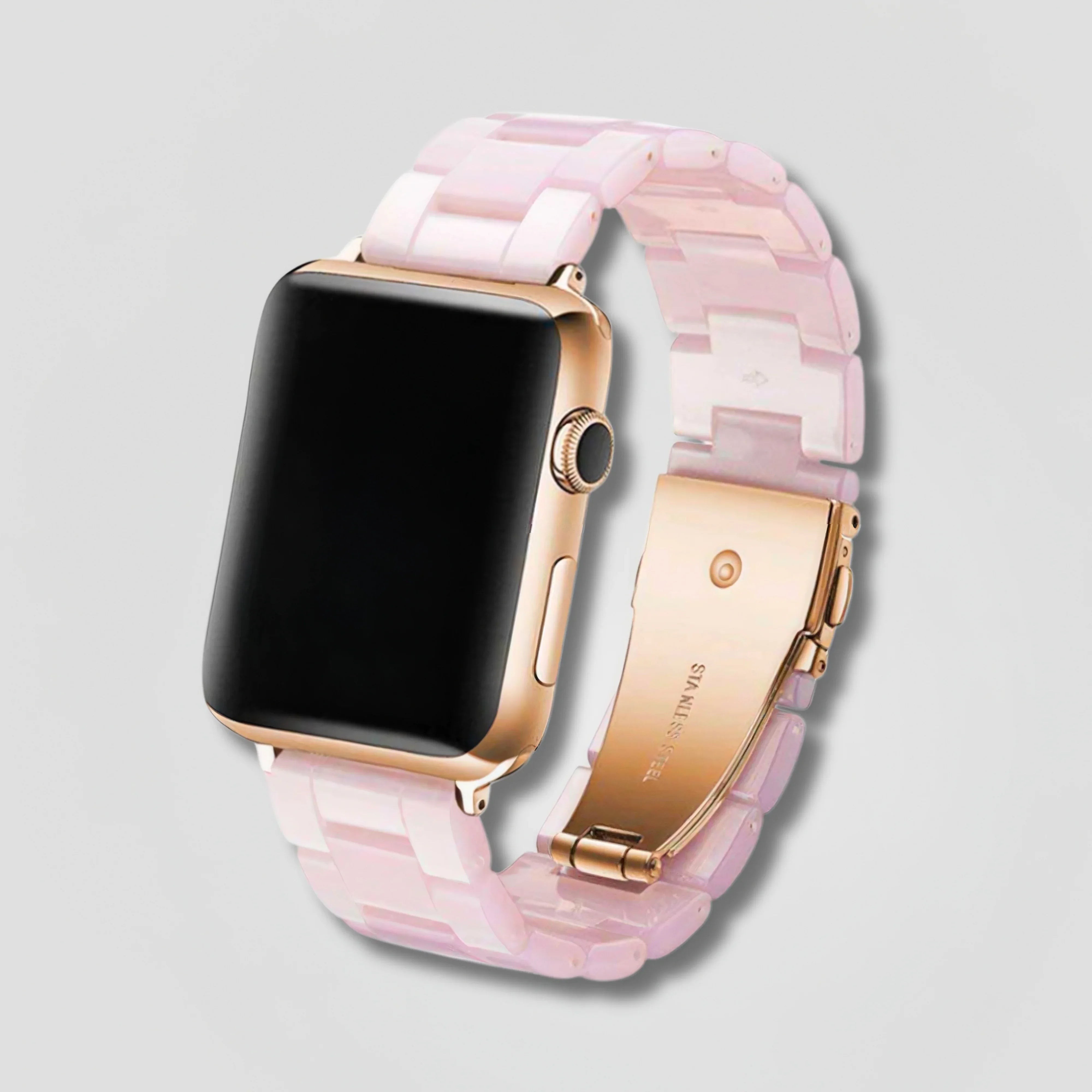 Image of Rose gold Apple Watch with pink pearl resin composite link band on gray background