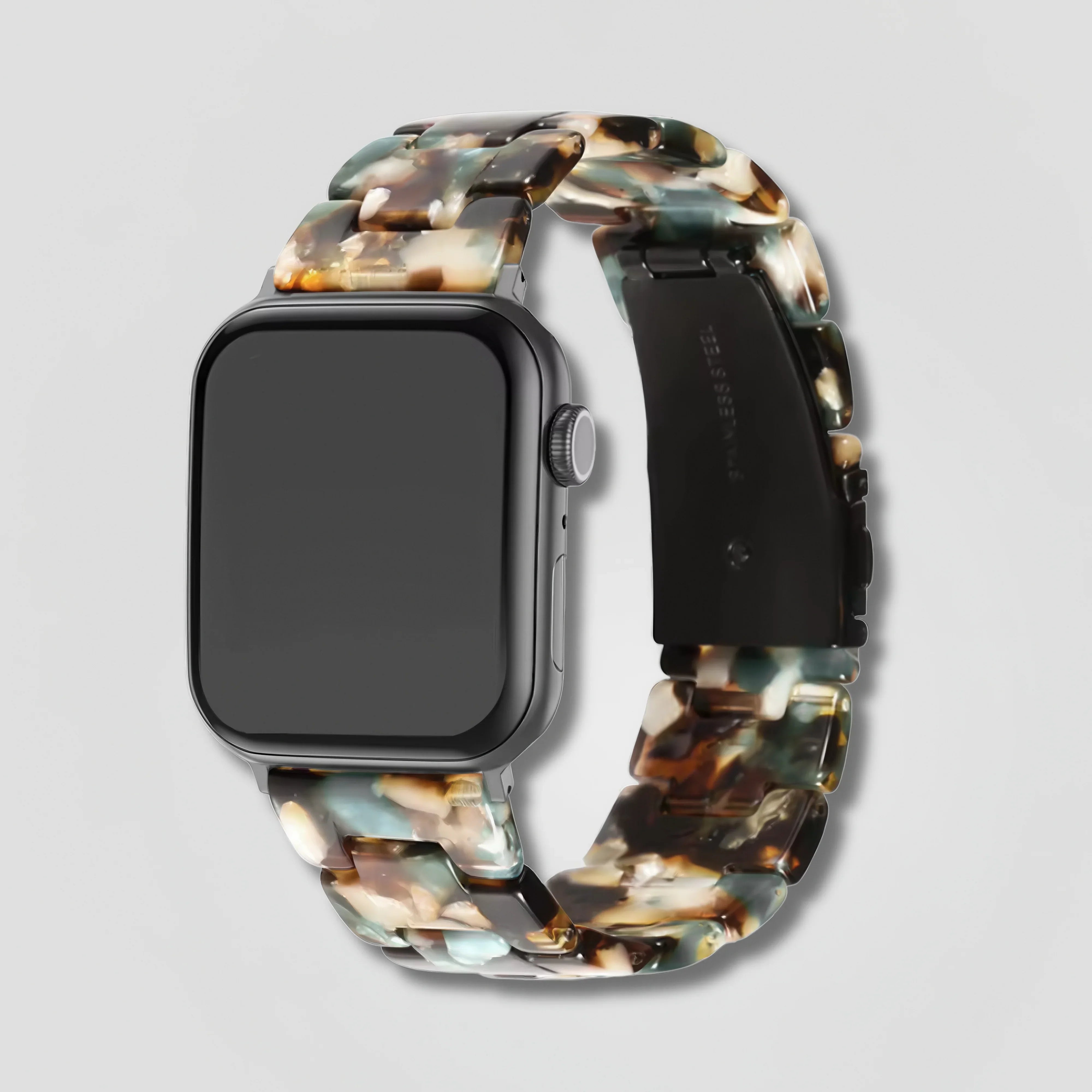 Lyra resin composite link tortoiseshell Apple Watch band on black smartwatch