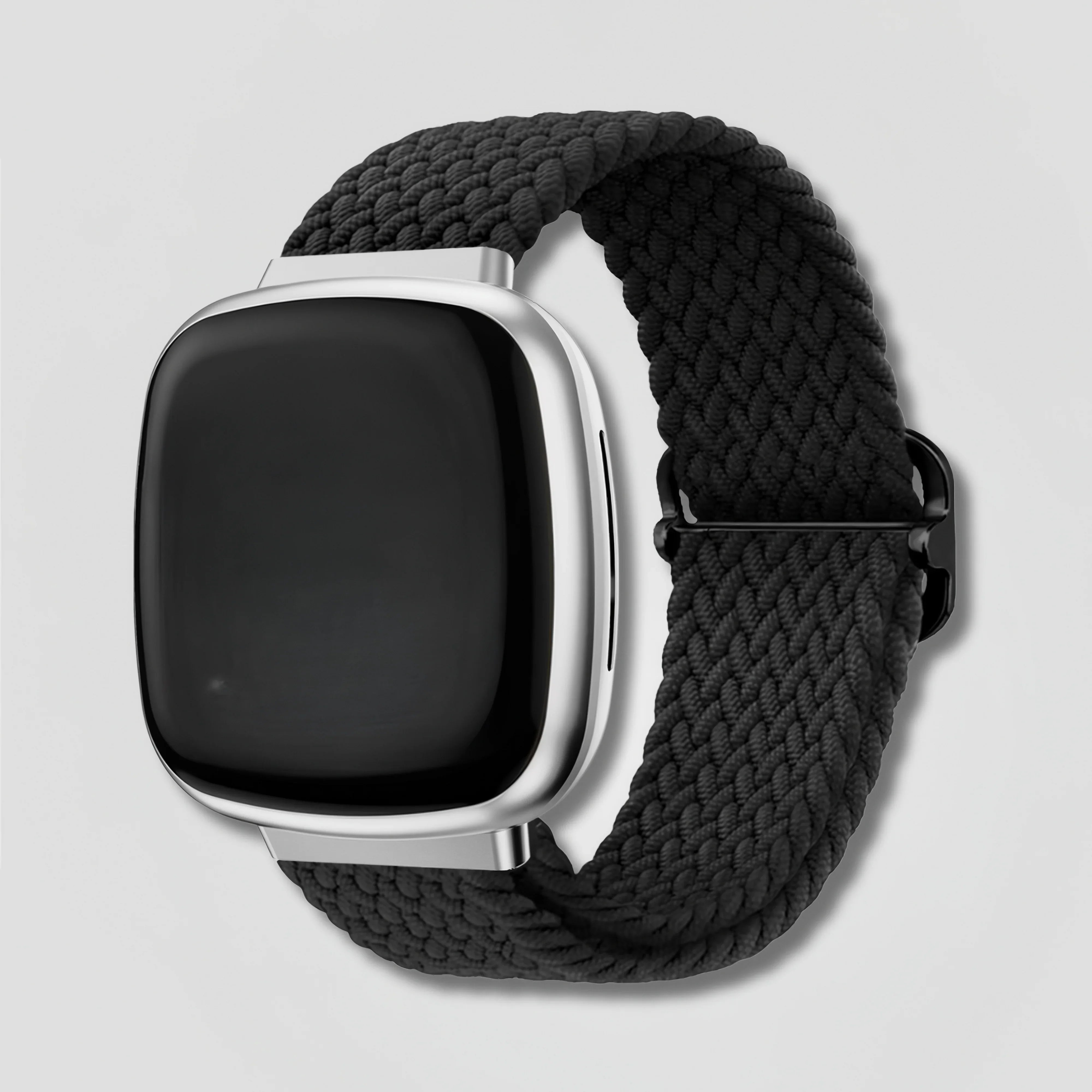 Image of Black braided loop band on Fitbit Versa 3 or Sense smartwatch against white background