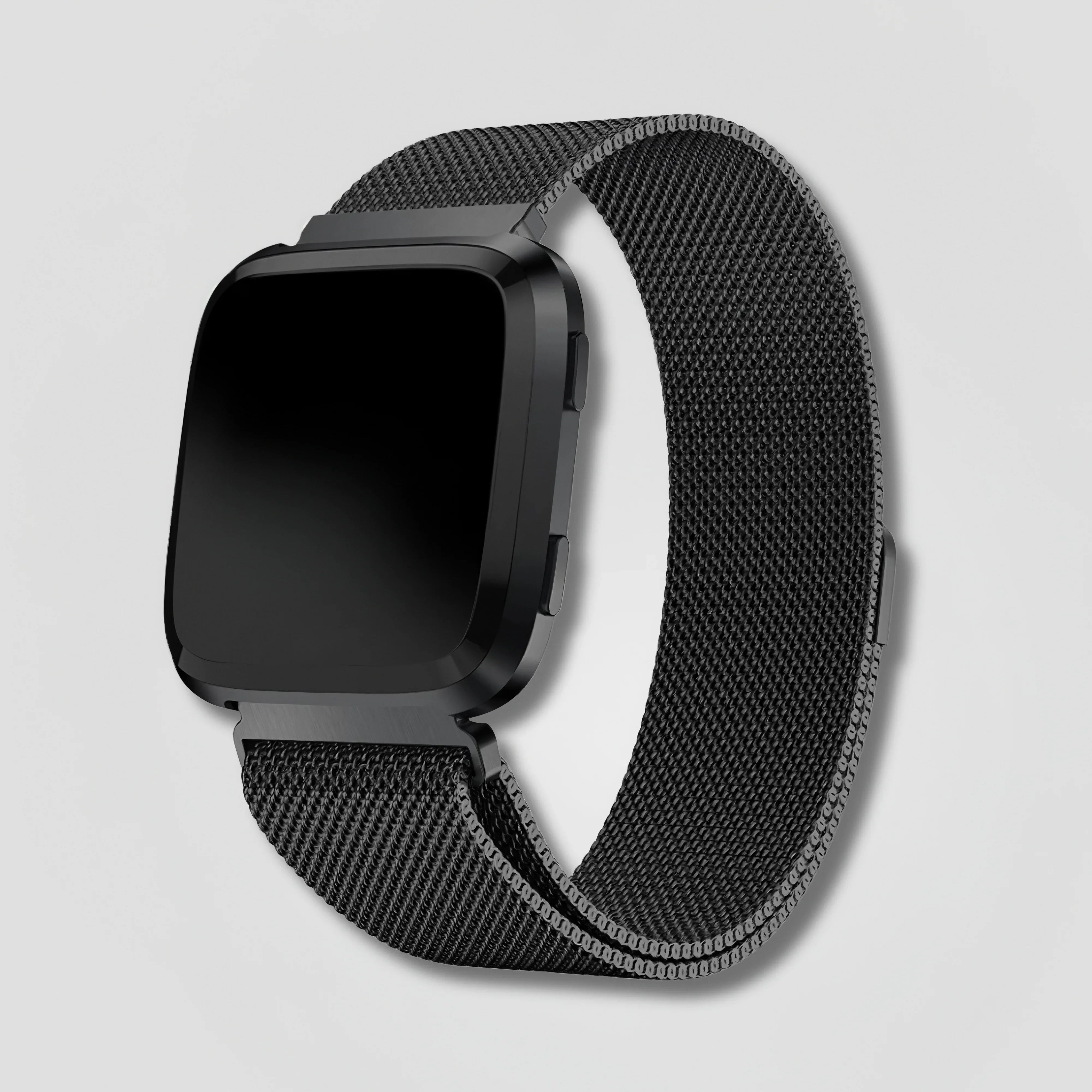 Black smart watch with metal mesh band on a plain light background