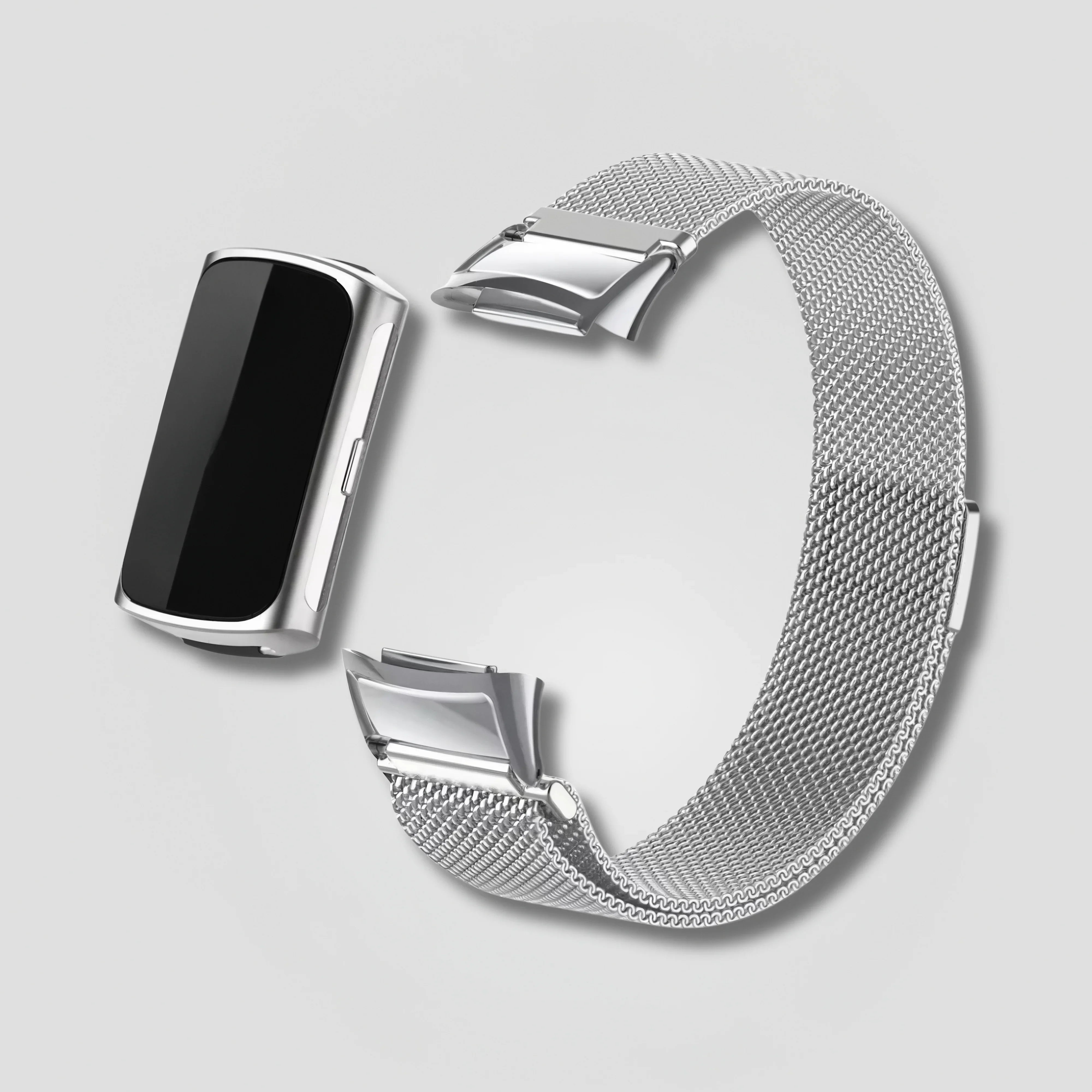 Silver magnetic Milanese band and case for Fitbit Charge against a plain background