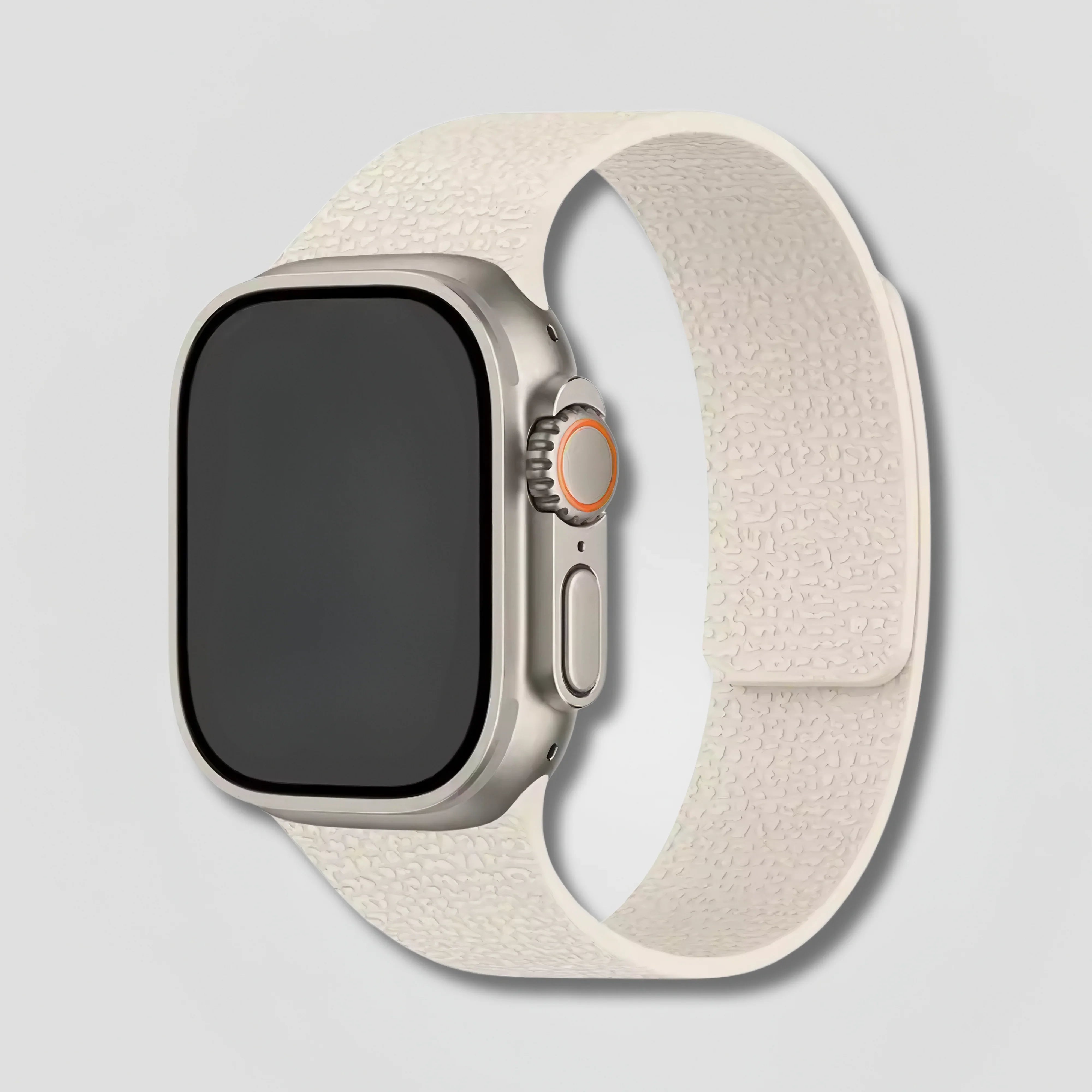 Ivory magnetic loop band on Apple Watch with textured design, shown on light background