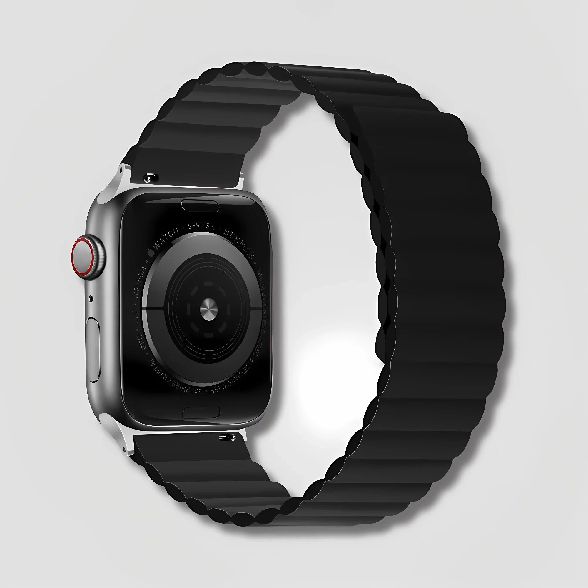 Black magnetic silicone band for Apple Watch with clasp detail on light background