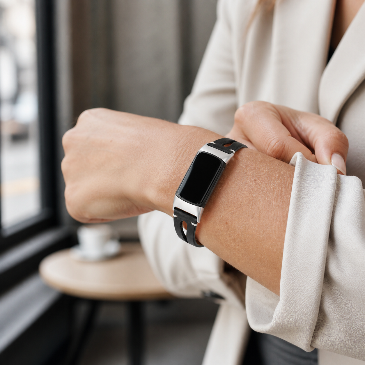 Image of Black Leora Genuine Leather Band for Fitbit Charge 5/6 in a refined lifestyle setting